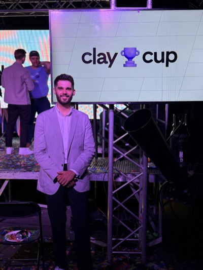 Jake at the Clay Cup sign